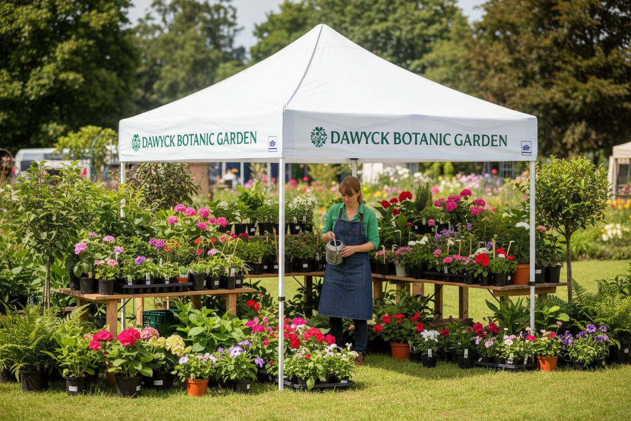 White canopy tent with 'Dawyck Botanic Garden' branding on a white background