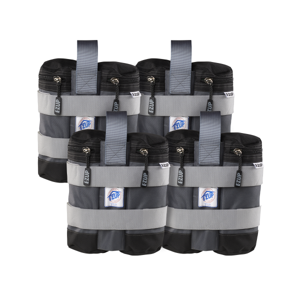 Four black weight bags with gray straps and white branding labels, designed to be attached to shelter legs for stability.